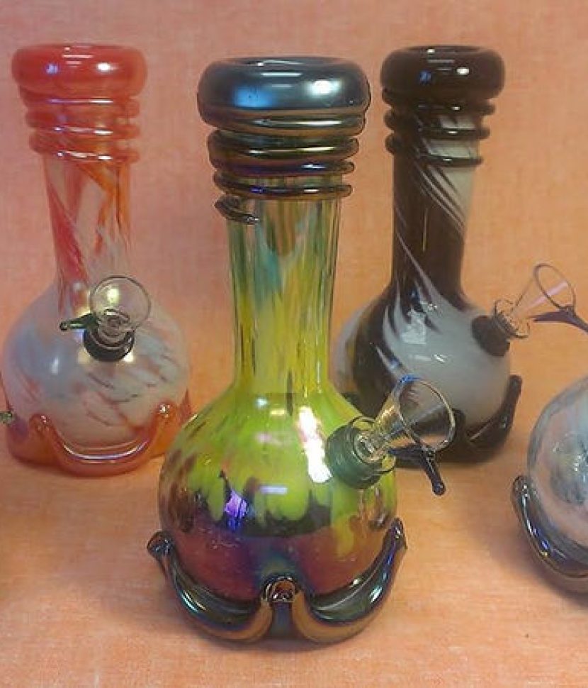 A collection of five colorful glass pipes displayed together.